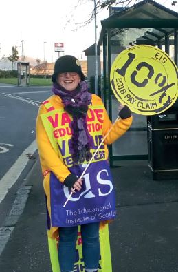 Paula McEwan wearing VEVT sandwich board