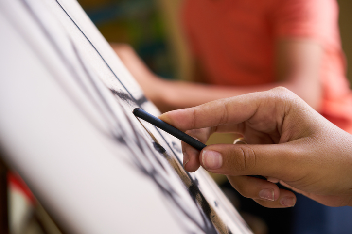 Closeup of someone sketching